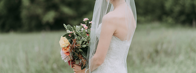 Woman holding a bouquet of wedding flowers