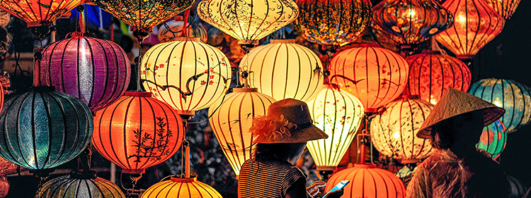 Two People Standing Near Different Coloured Celebration Lanterns Lunar New Year