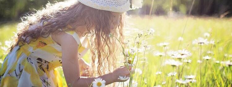 Girl picking a scented flower
