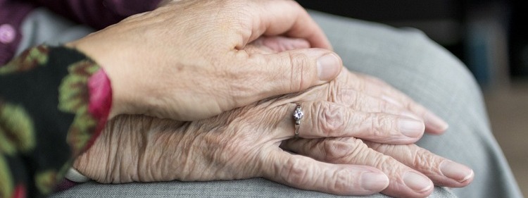 holding elderly hands